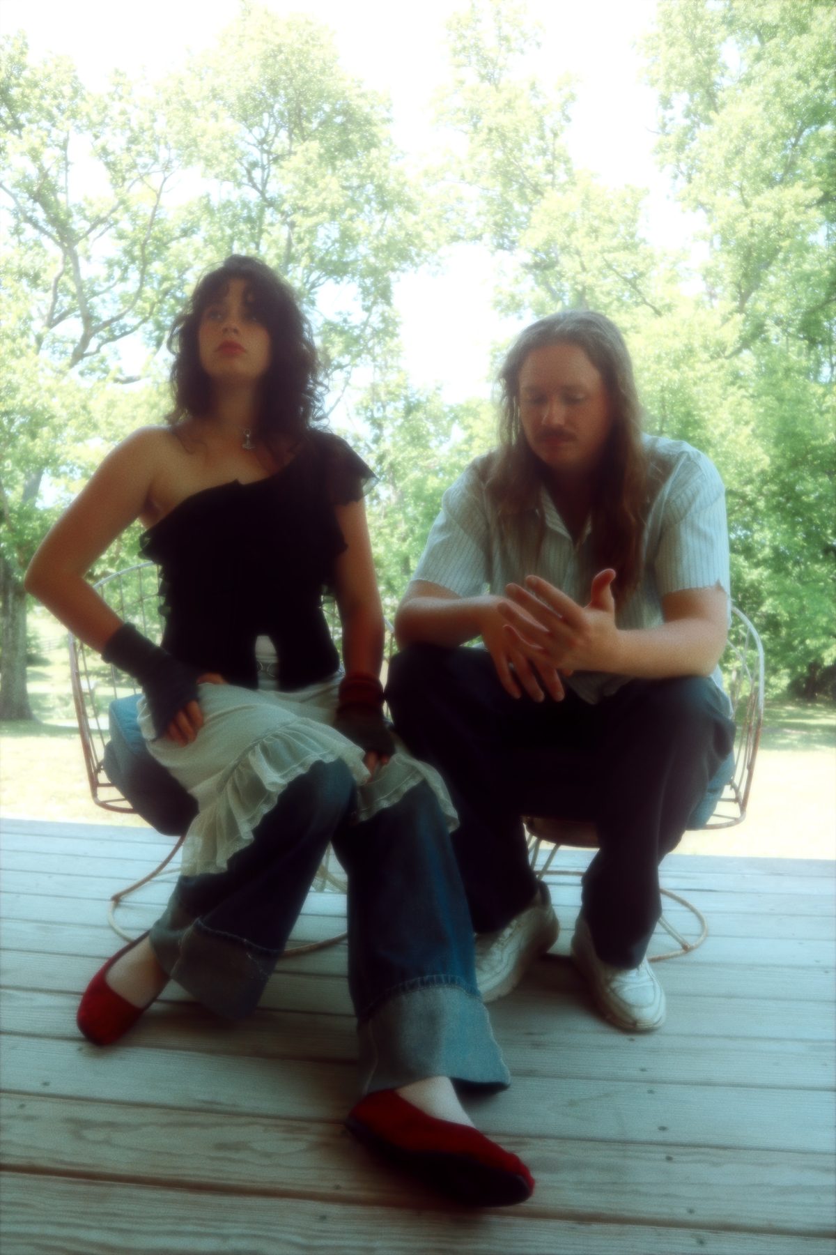 Eva Arnby and Ben Becker sitting on a porch