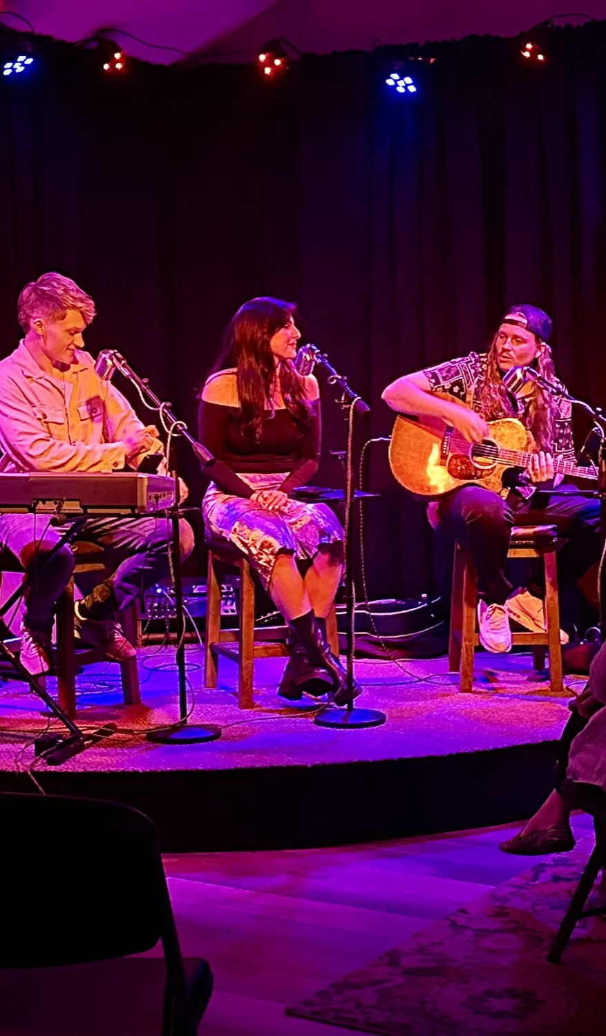 Three songwriters on the corner stage